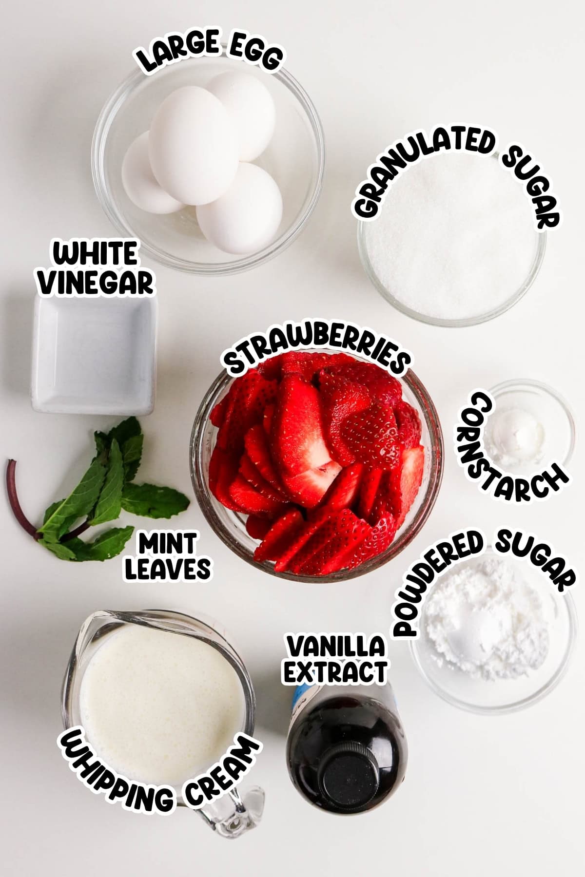 Baking ingredients including eggs, strawberries, sugars, cream, vanilla, and mint.