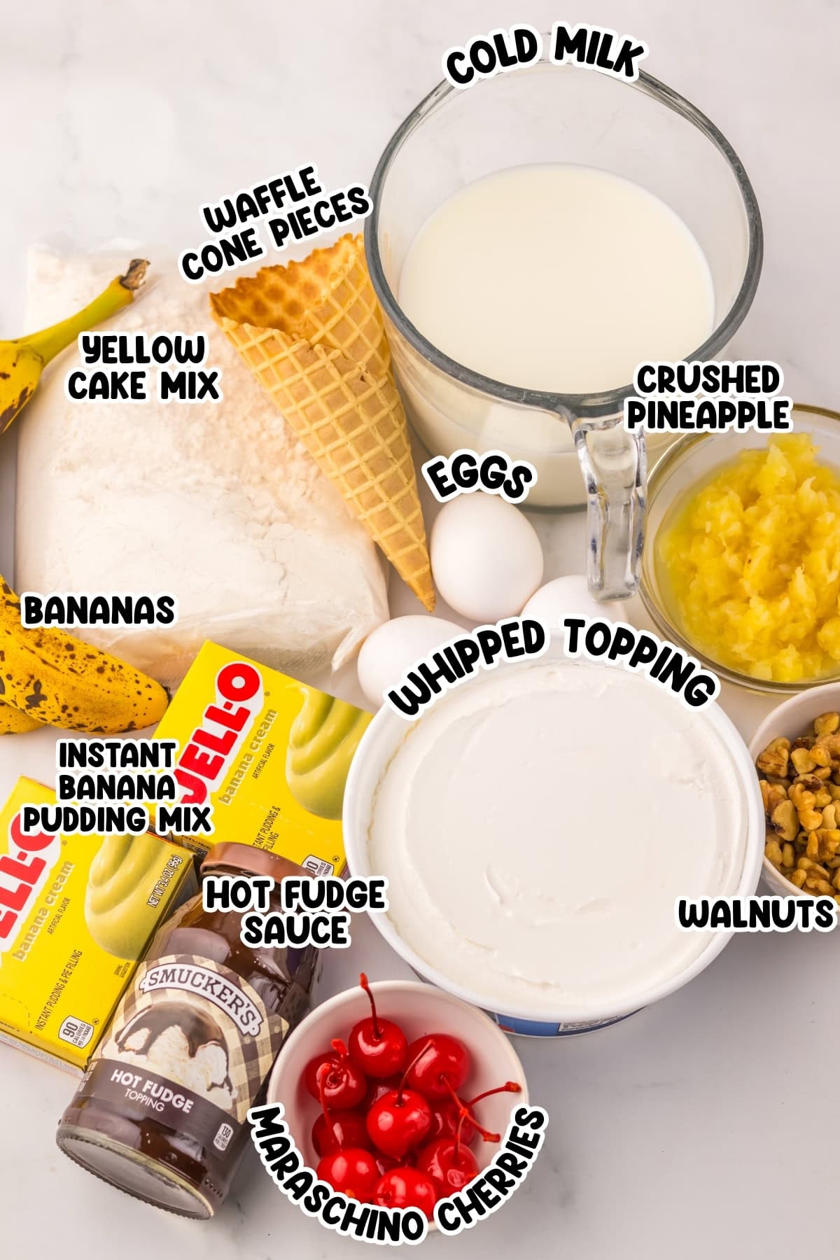 Ingredients for banana split dessert including cake mix, bananas, milk, eggs, and toppings.
