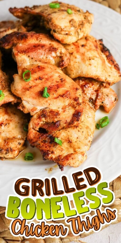 Grilled boneless chicken thighs garnished with green onions on a white plate.