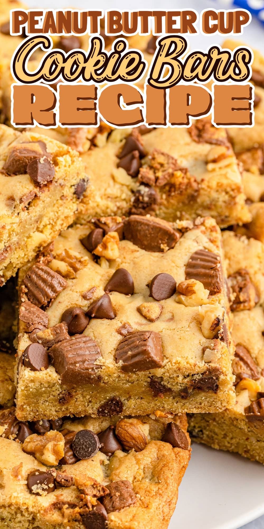 Peanut butter cup cookie bars topped with chocolate chips and nuts.