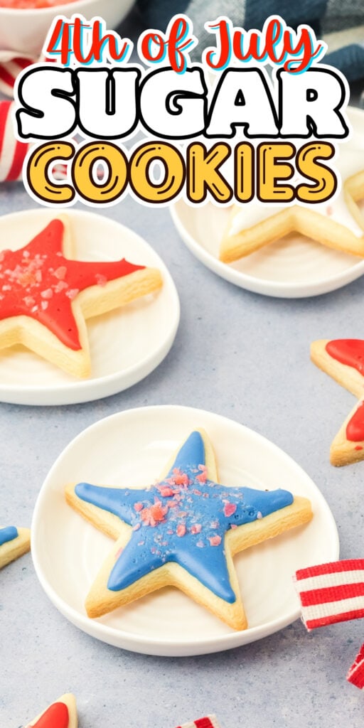 Star-shaped sugar cookies with red and blue icing on small white plates.