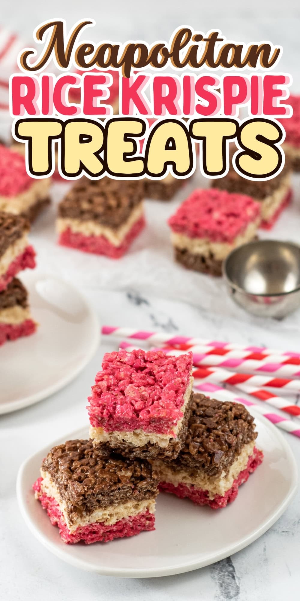 Three-layer Neapolitan Rice Krispie treats stacked on small white plates.