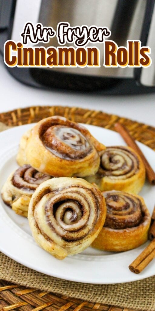 Cinnamon rolls with icing on a plate.