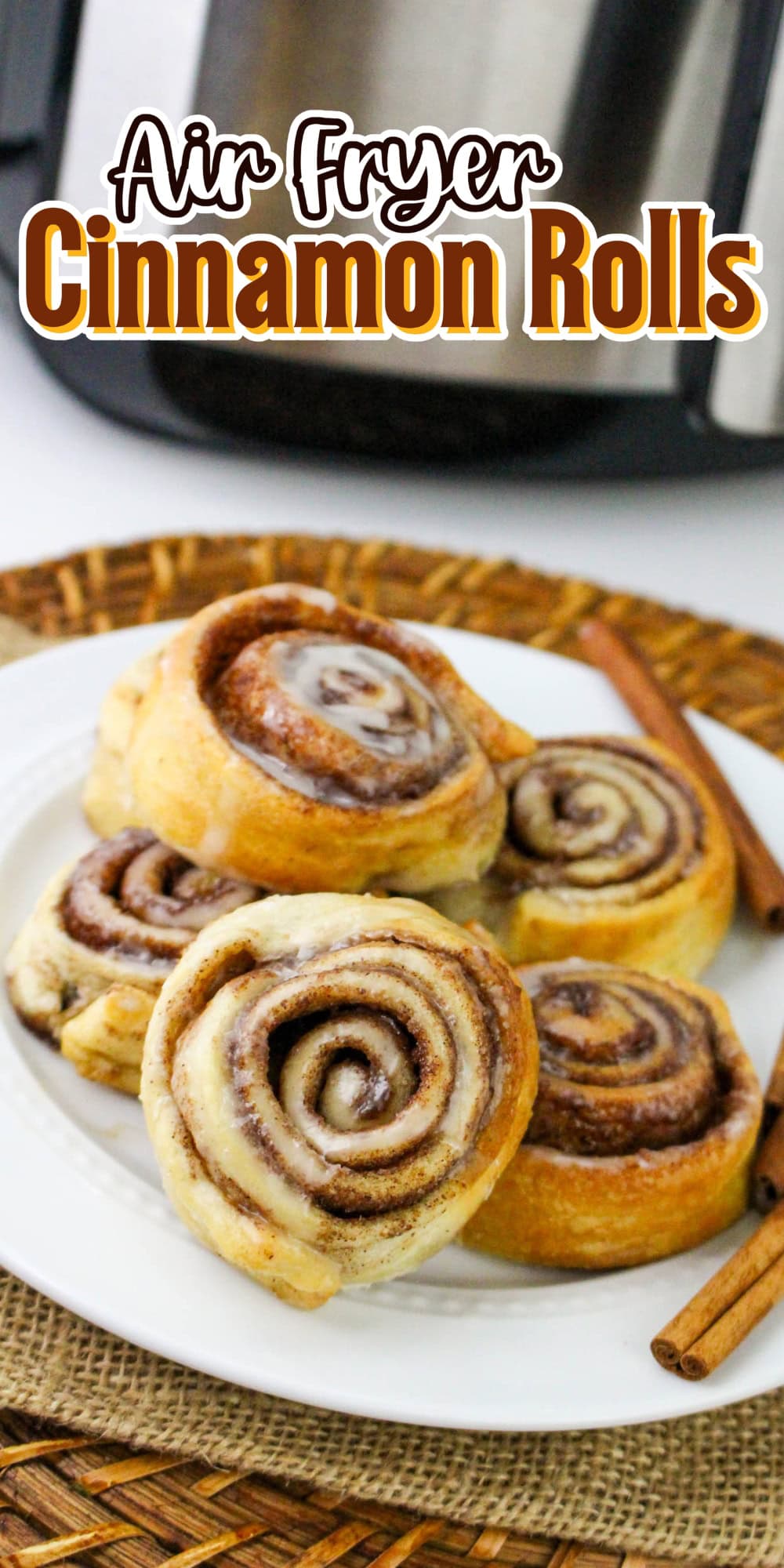 Cinnamon rolls with icing on a plate.