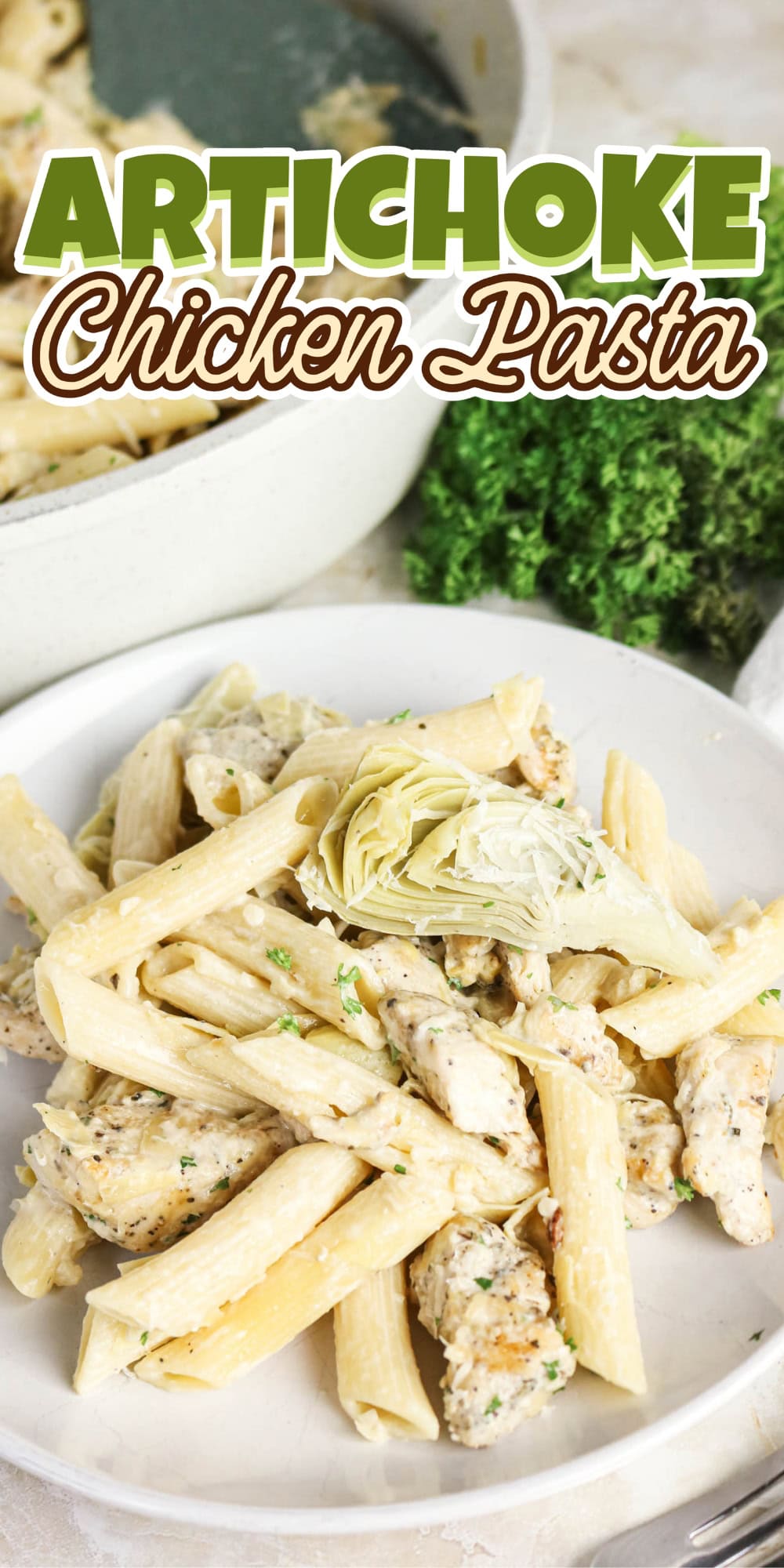 Plate of penne pasta with chicken and artichoke.