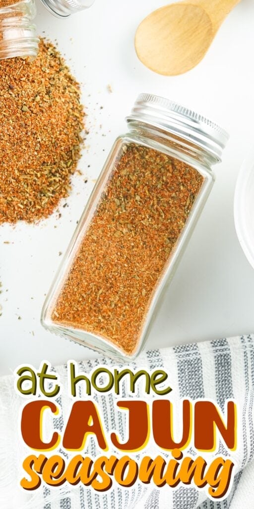 Jar of Cajun seasoning on a table.