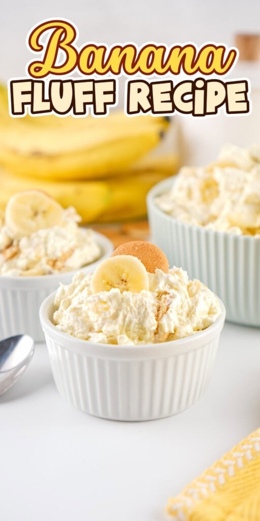 Banana fluff dessert in white ramekins, topped with banana slices and wafers.