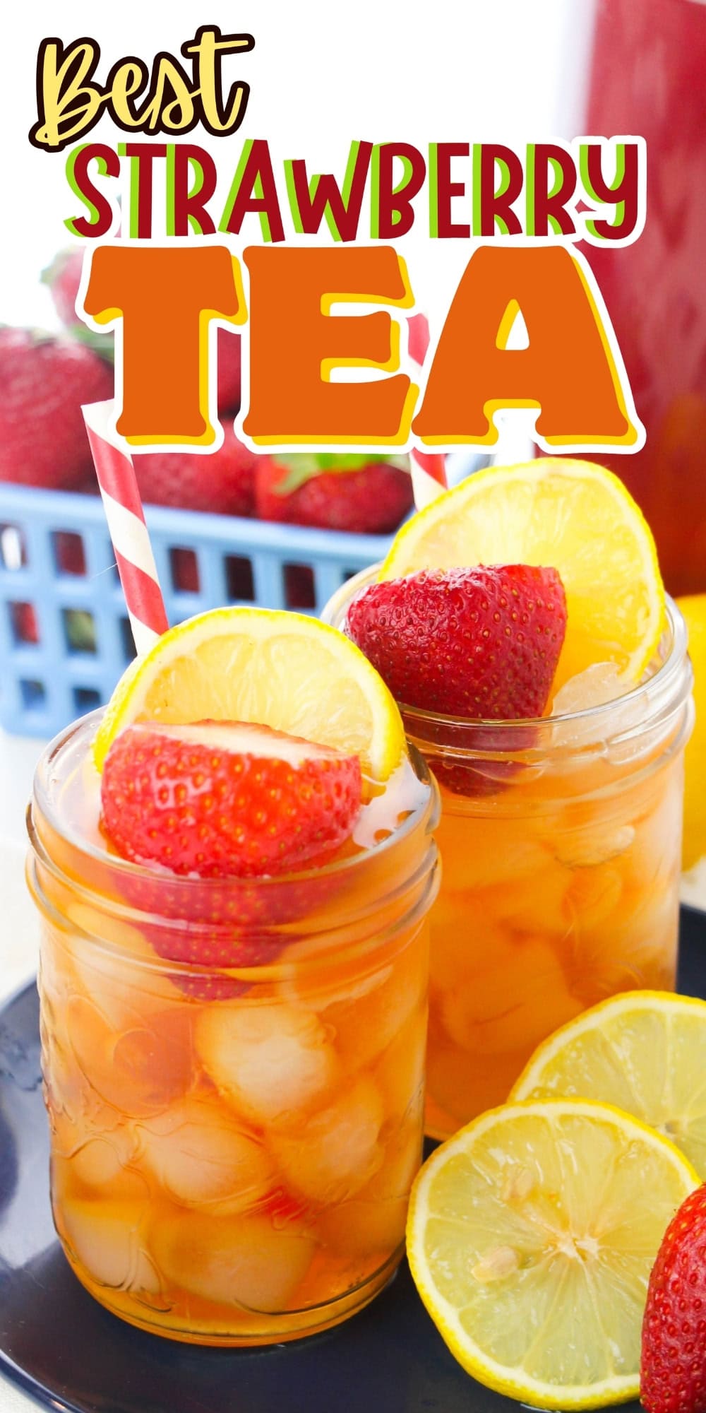 Two mason jars of iced strawberry tea with lemon and strawberry garnishes.