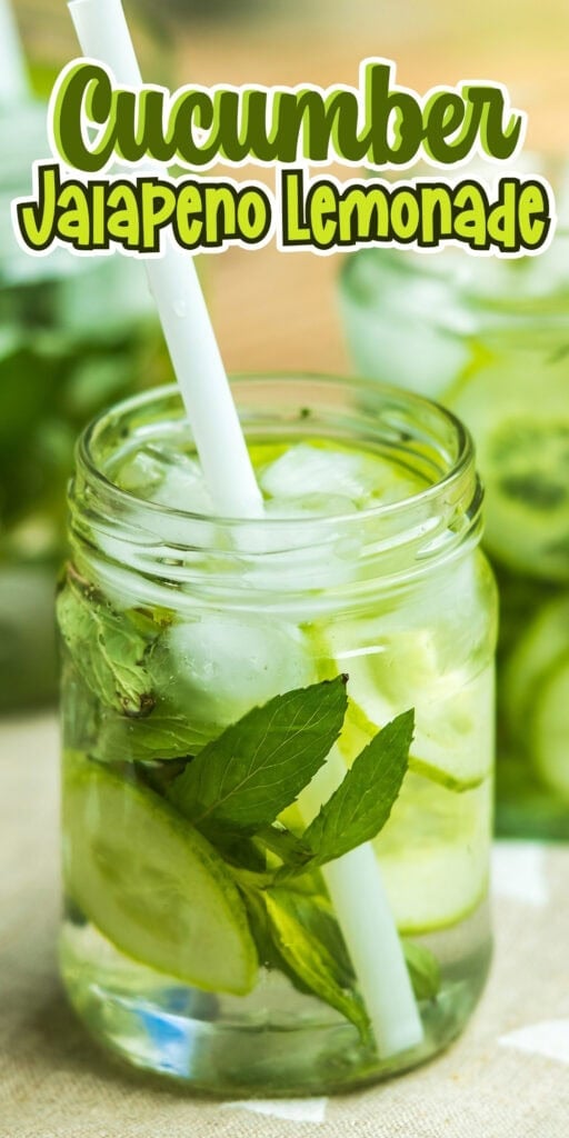 Cucumber jalapeño lemonade in a mason jar with mint, ice, and a straw.