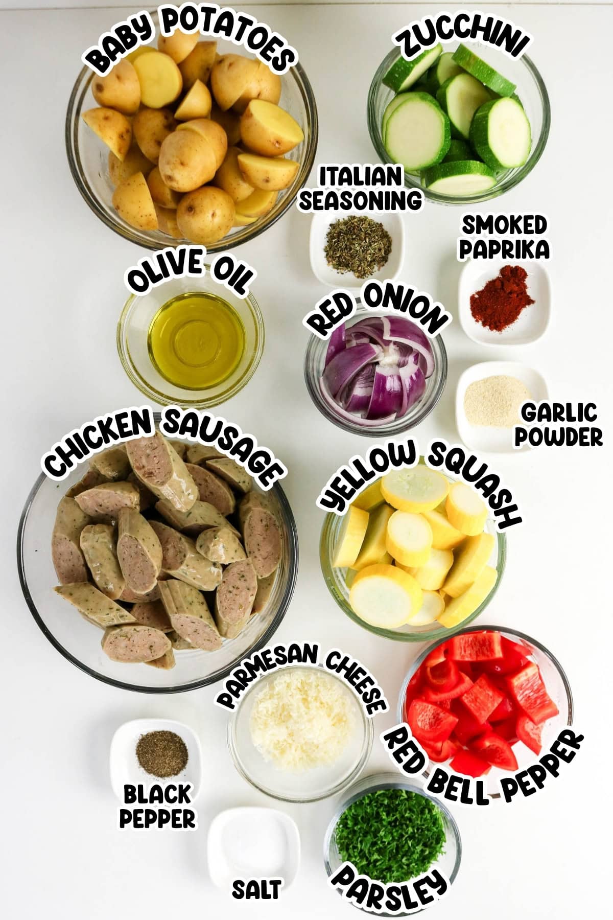Baby potatoes, zucchini, squash, peppers, sausage, onion, spices, parmesan, parsley.