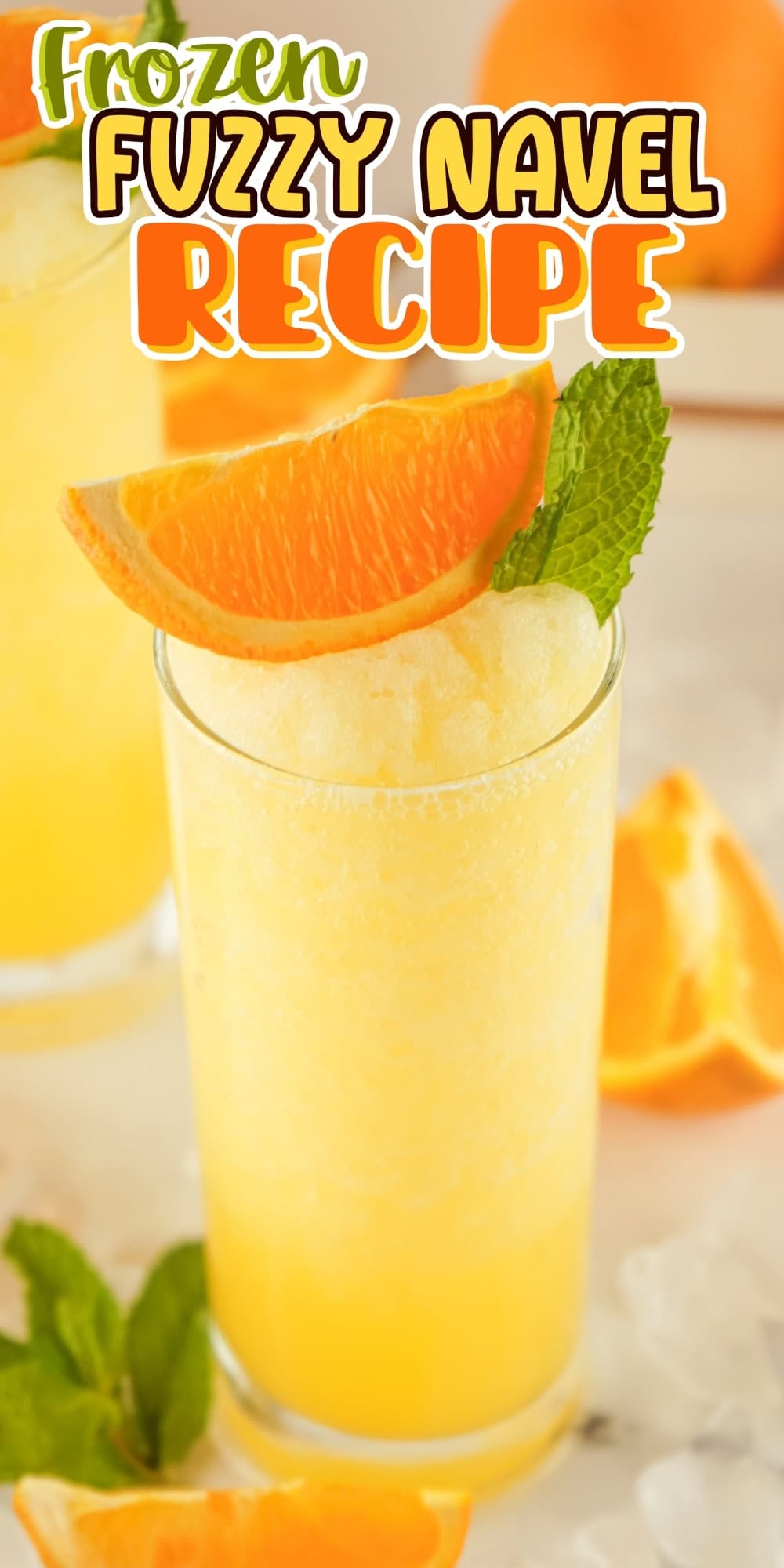 Frozen fuzzy navel drink garnished with orange slice and mint.