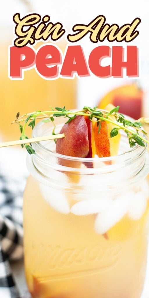 A peach-infused gin cocktail in a mason jar, garnished with peach and herbs.