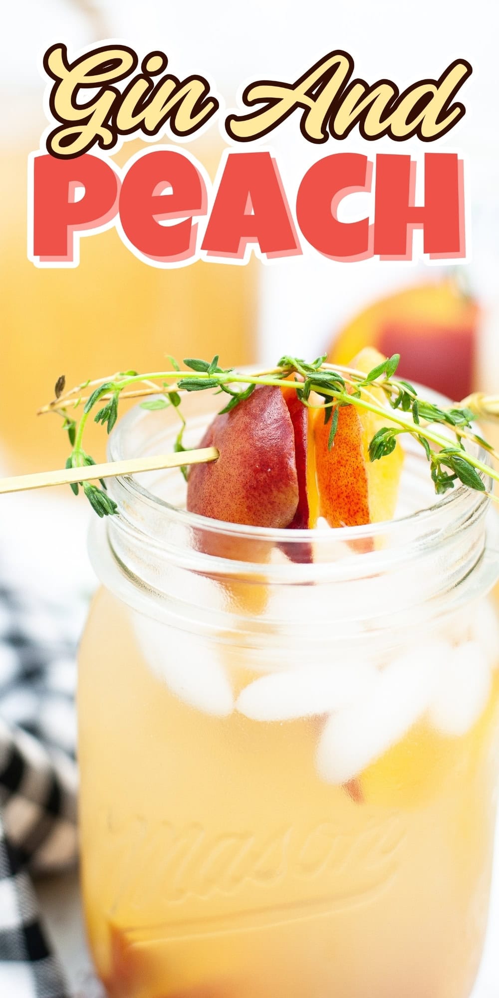 A peach-infused gin cocktail in a mason jar, garnished with peach and herbs.