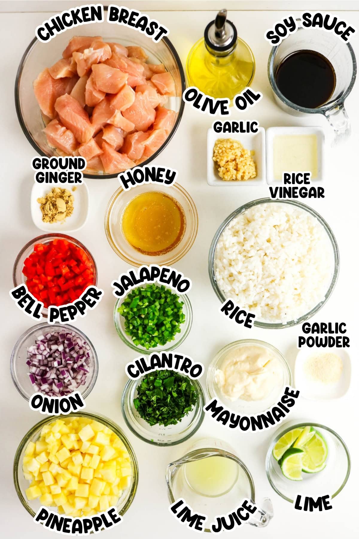 Ingredients for a chicken rice bowl arranged in bowls.