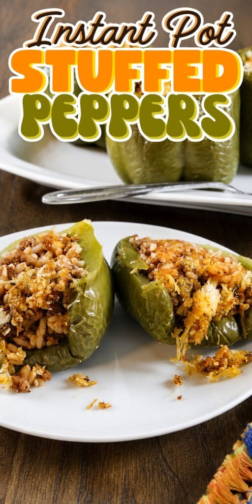 Stuffed green peppers with rice on a white plate.