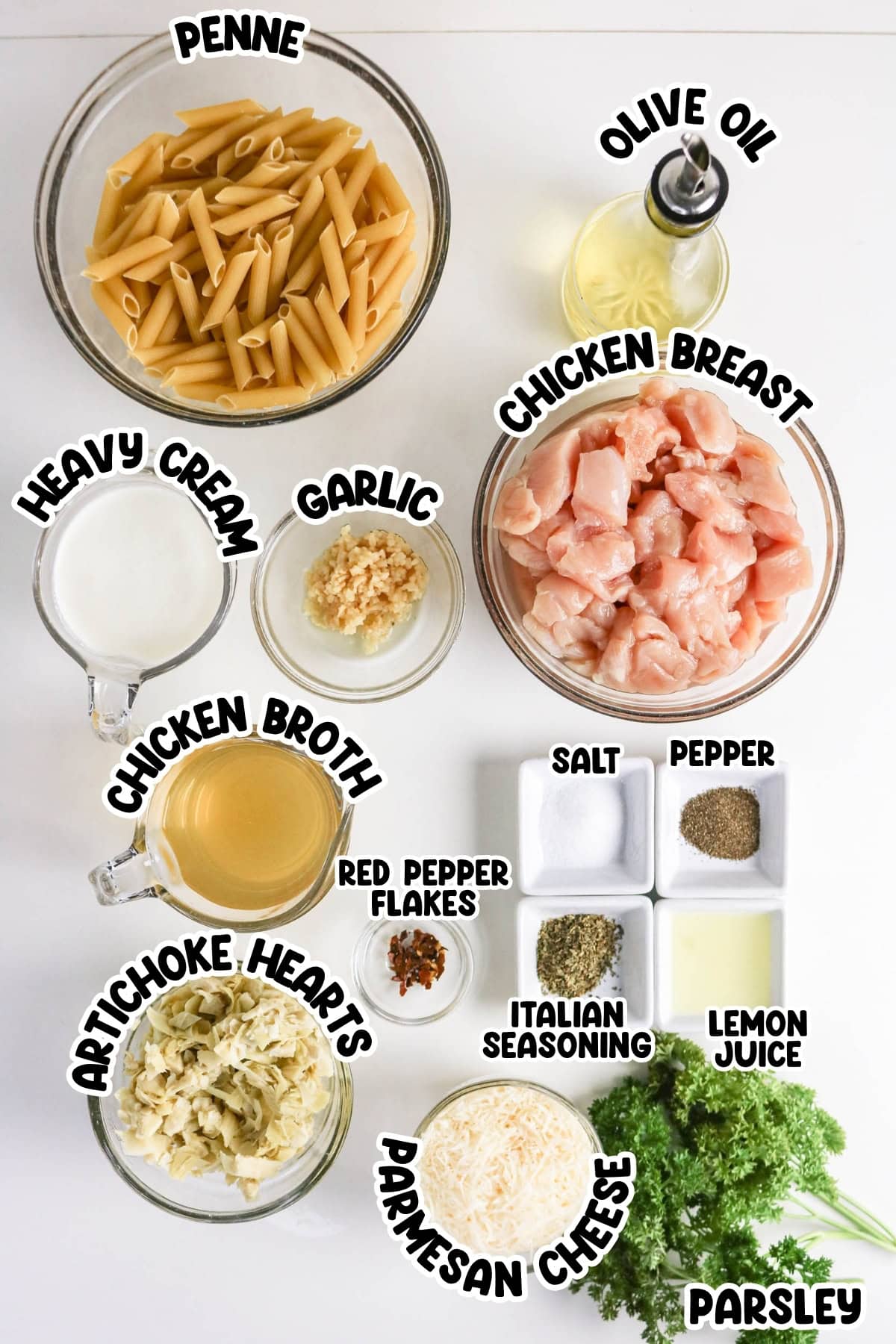 Pasta, chicken, and various labeled ingredients for a creamy chicken pasta recipe.
