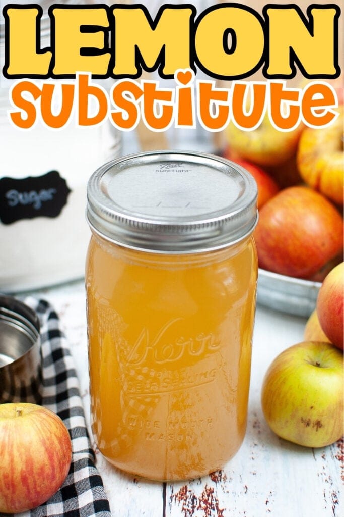 Jar of lemon substitute with apples and sugar in the background.