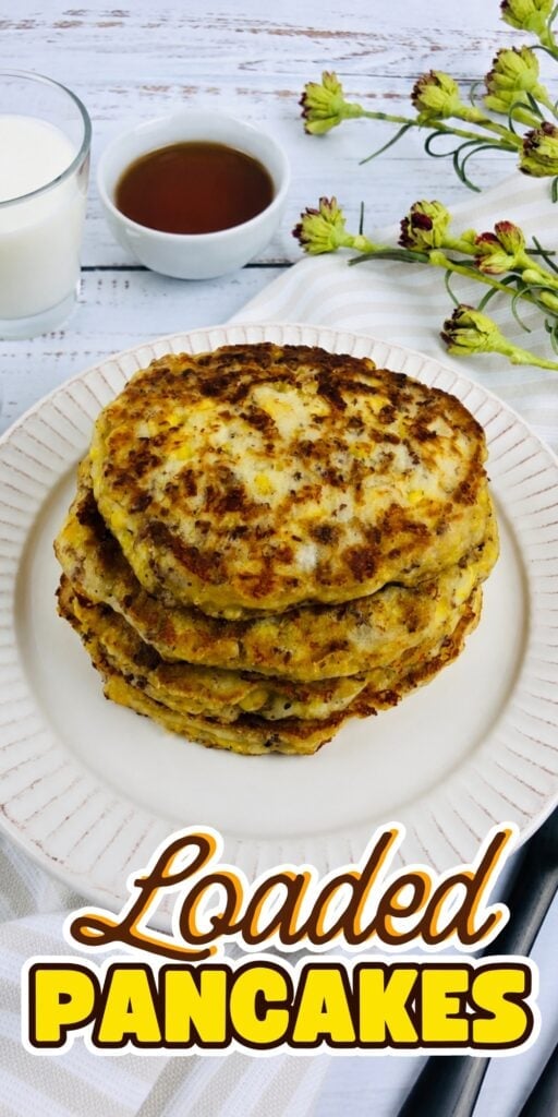 Pancakes with syrup, served with a cold glass of milk.