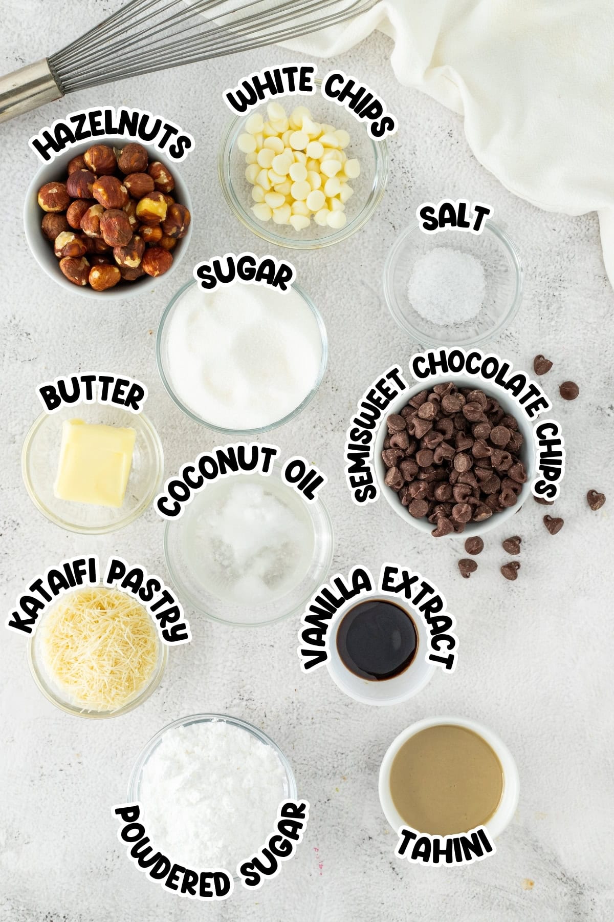 Hazelnuts, white chips, salt, sugar, butter, coconut oil, choc chips, kataifi, vanilla, tahini, powdered sugar.