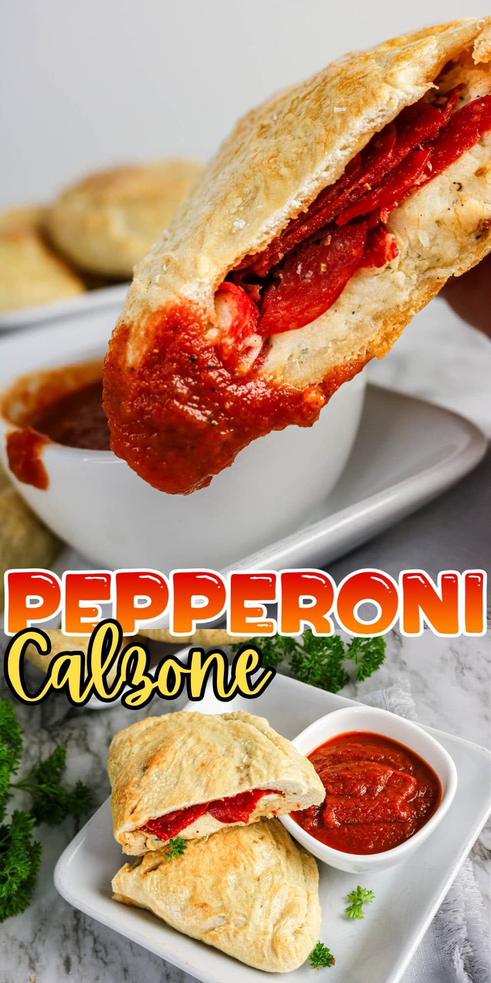 A pepperoni calzone dipped in marinara sauce, with another on a plate.