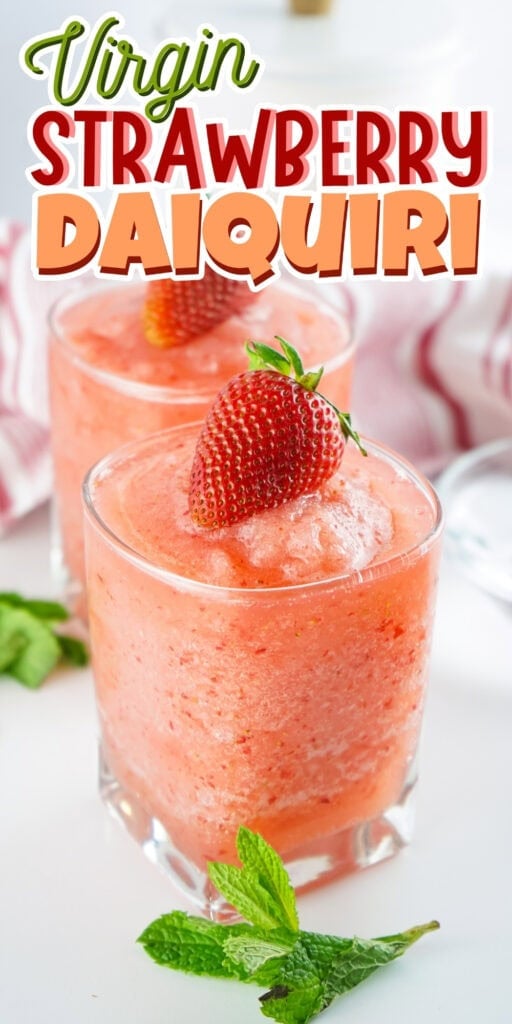 Two glasses of virgin strawberry daiquiri, garnished with strawberries and mint.