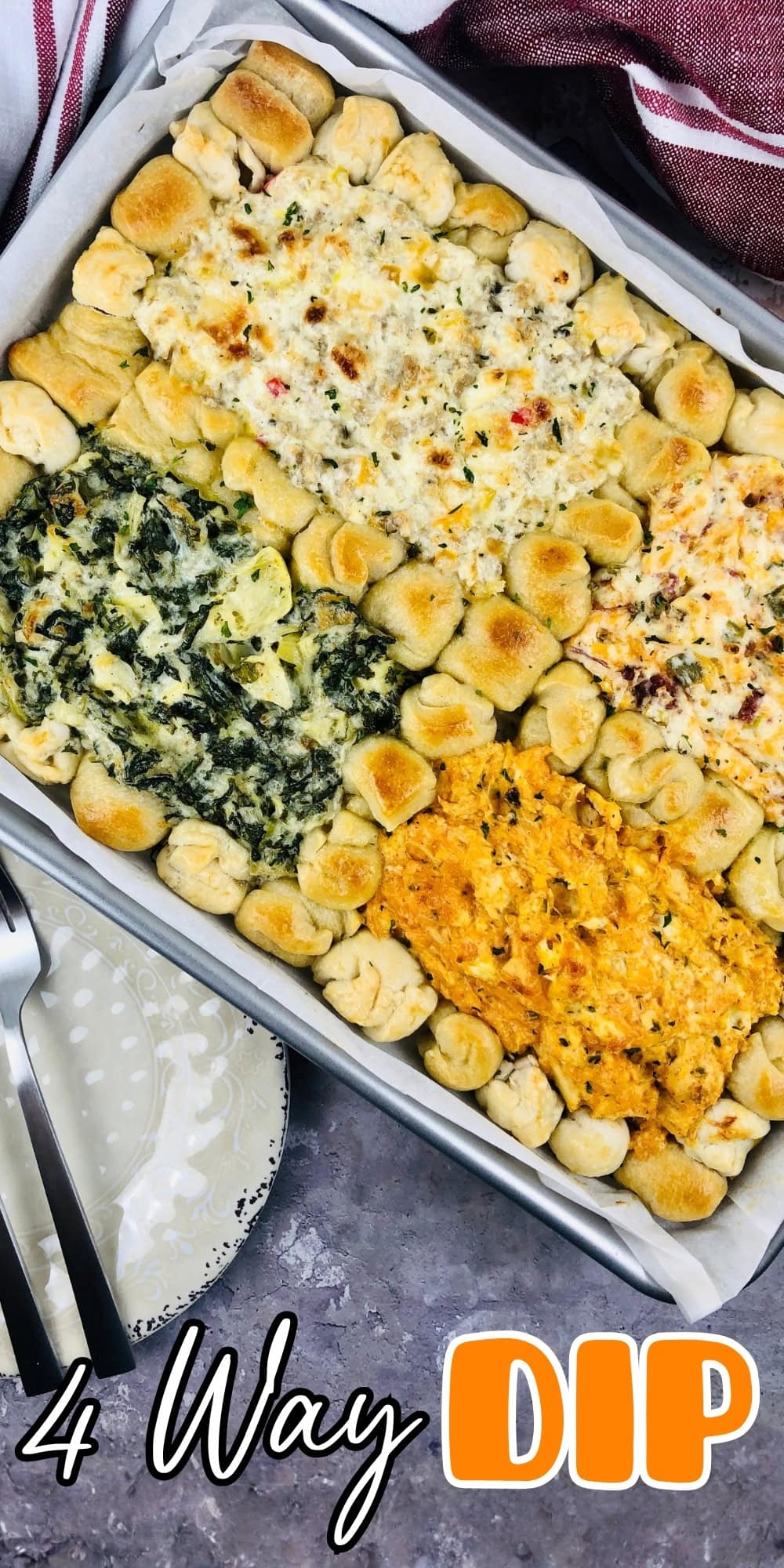 Baked bread ring with four different dips in the center of a pan.