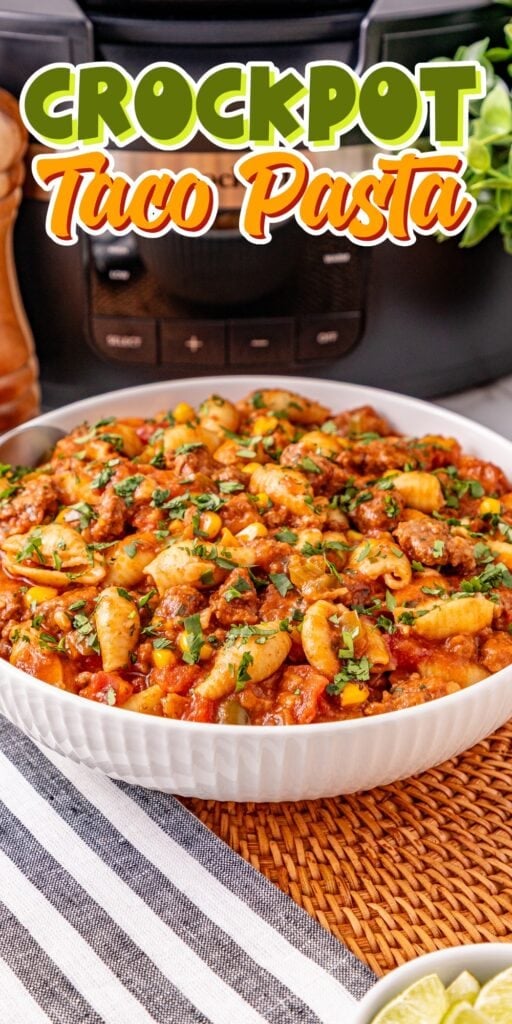 Bowl of taco pasta in front of a crockpot.