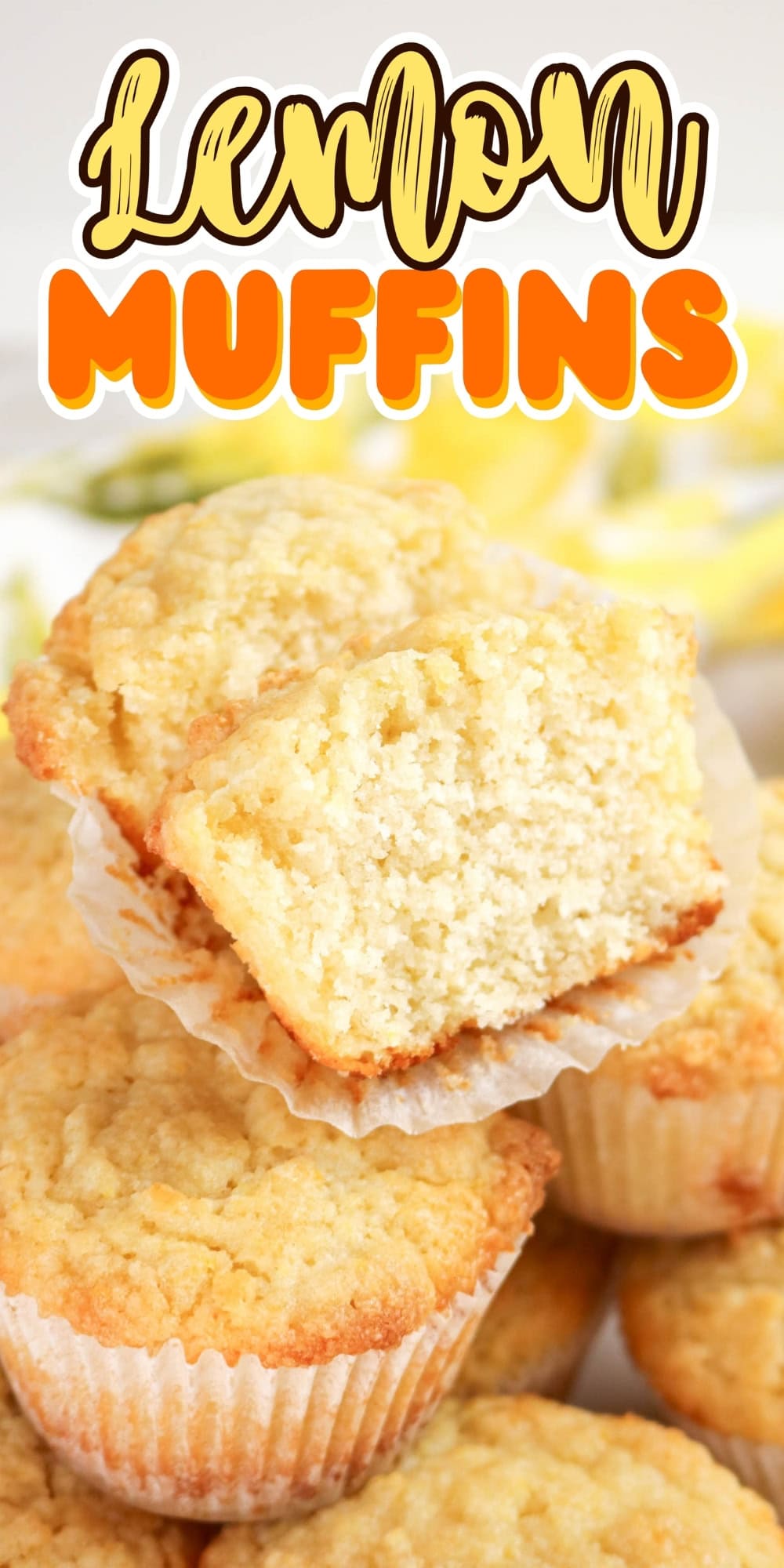 A stack of lemon muffins, one broken in half.