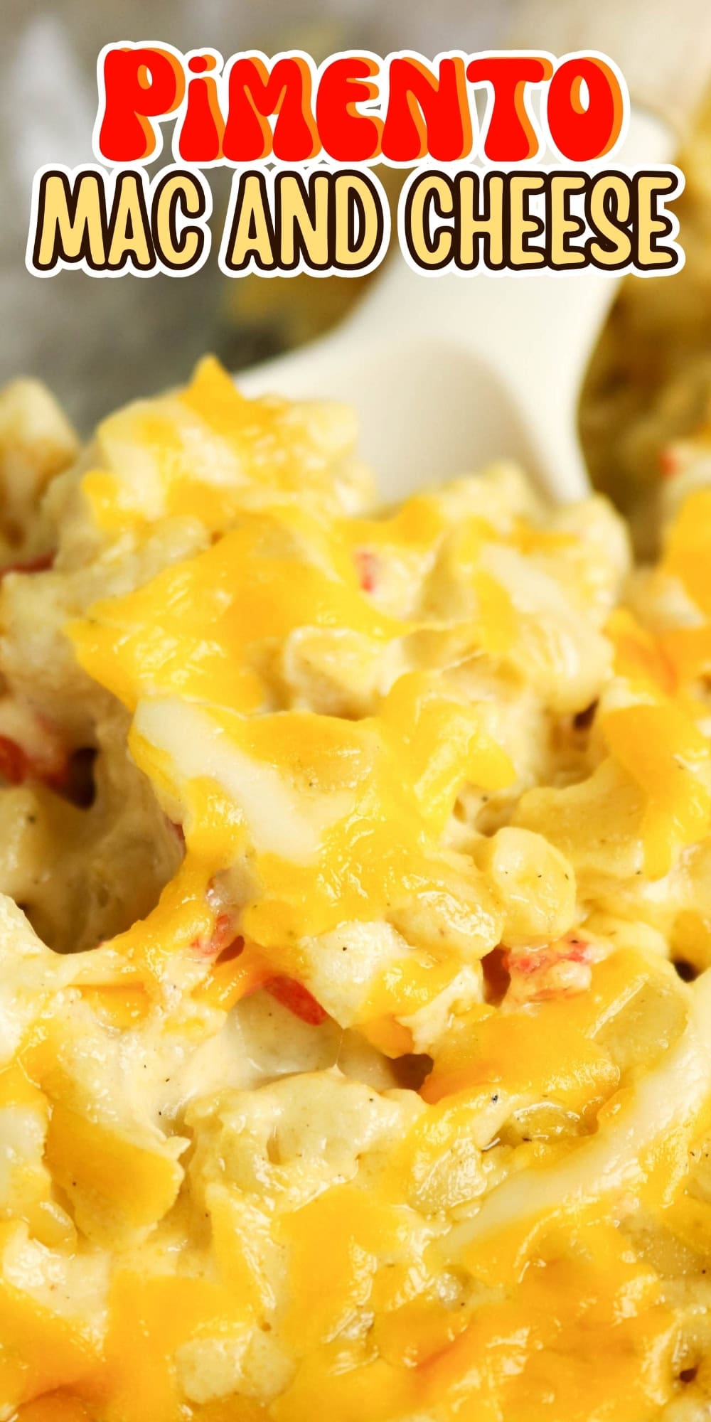 Creamy baked mac and cheese with pimentos, topped with melted cheddar cheese.
