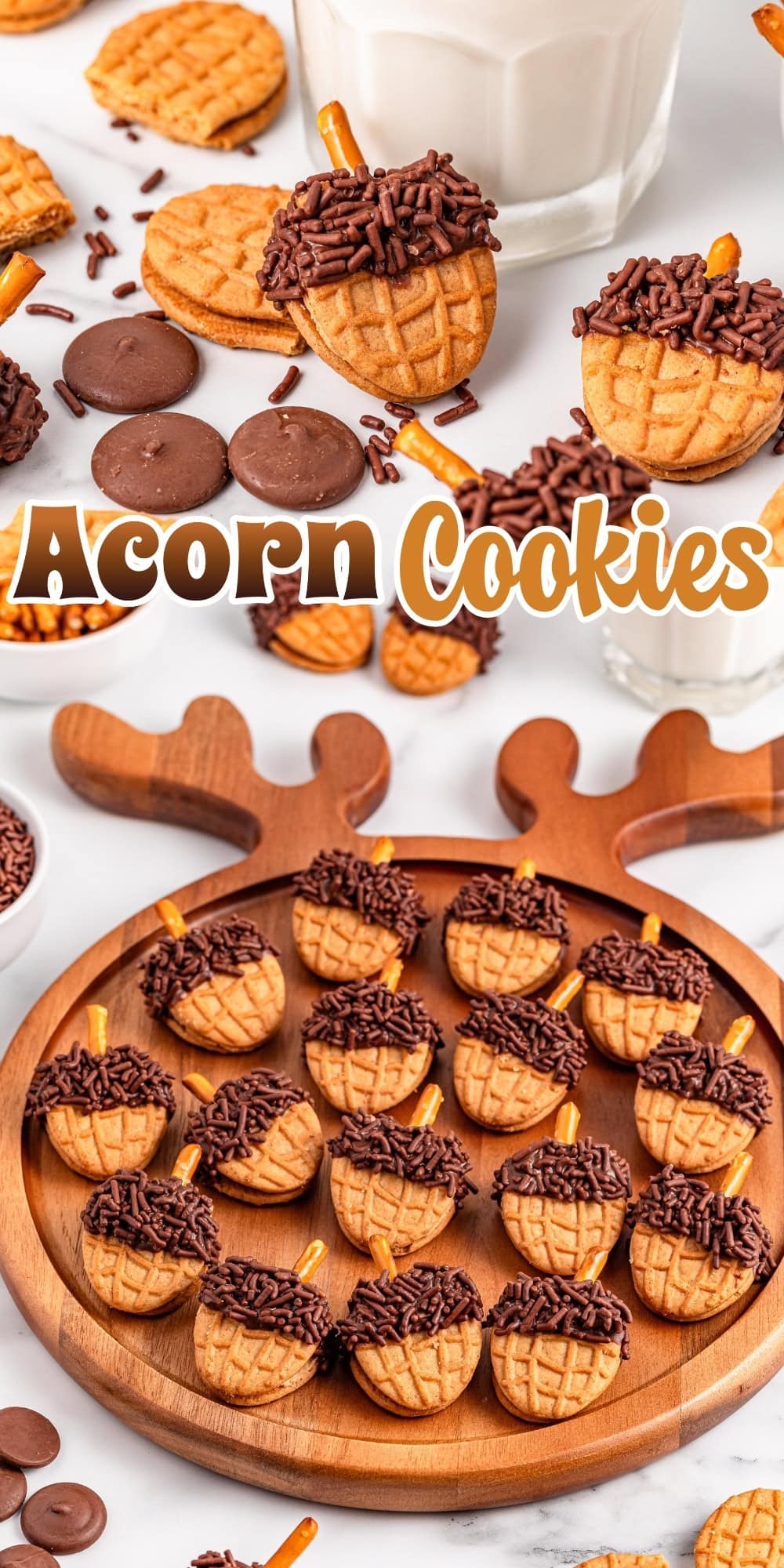 Acorn-shaped cookies with chocolate, sprinkles, and pretzel stems on a platter.