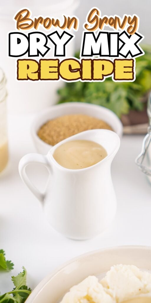 Gravy in a white pitcher, brown gravy dry mix and greens in the background.