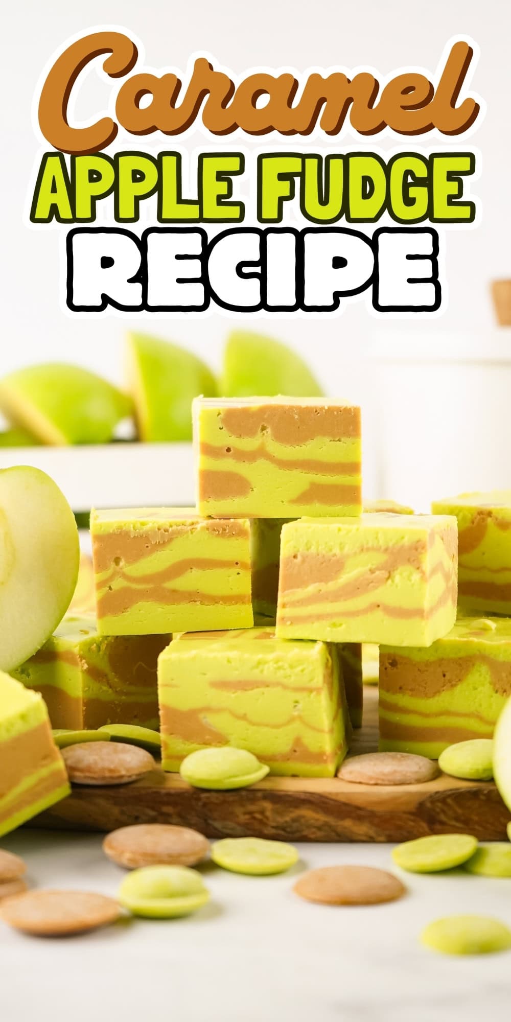 Green and caramel fudge squares with apples and caramel candies around them.