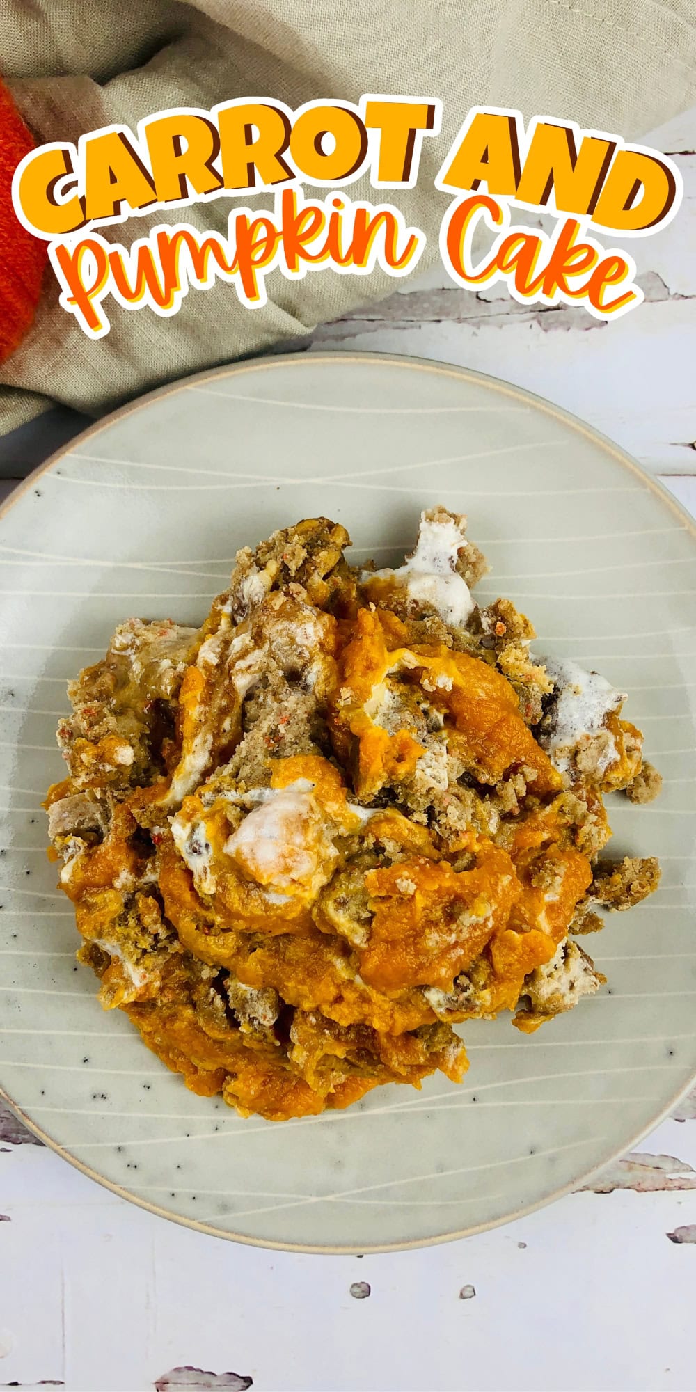 A slice of carrot and pumpkin cake on a plate.