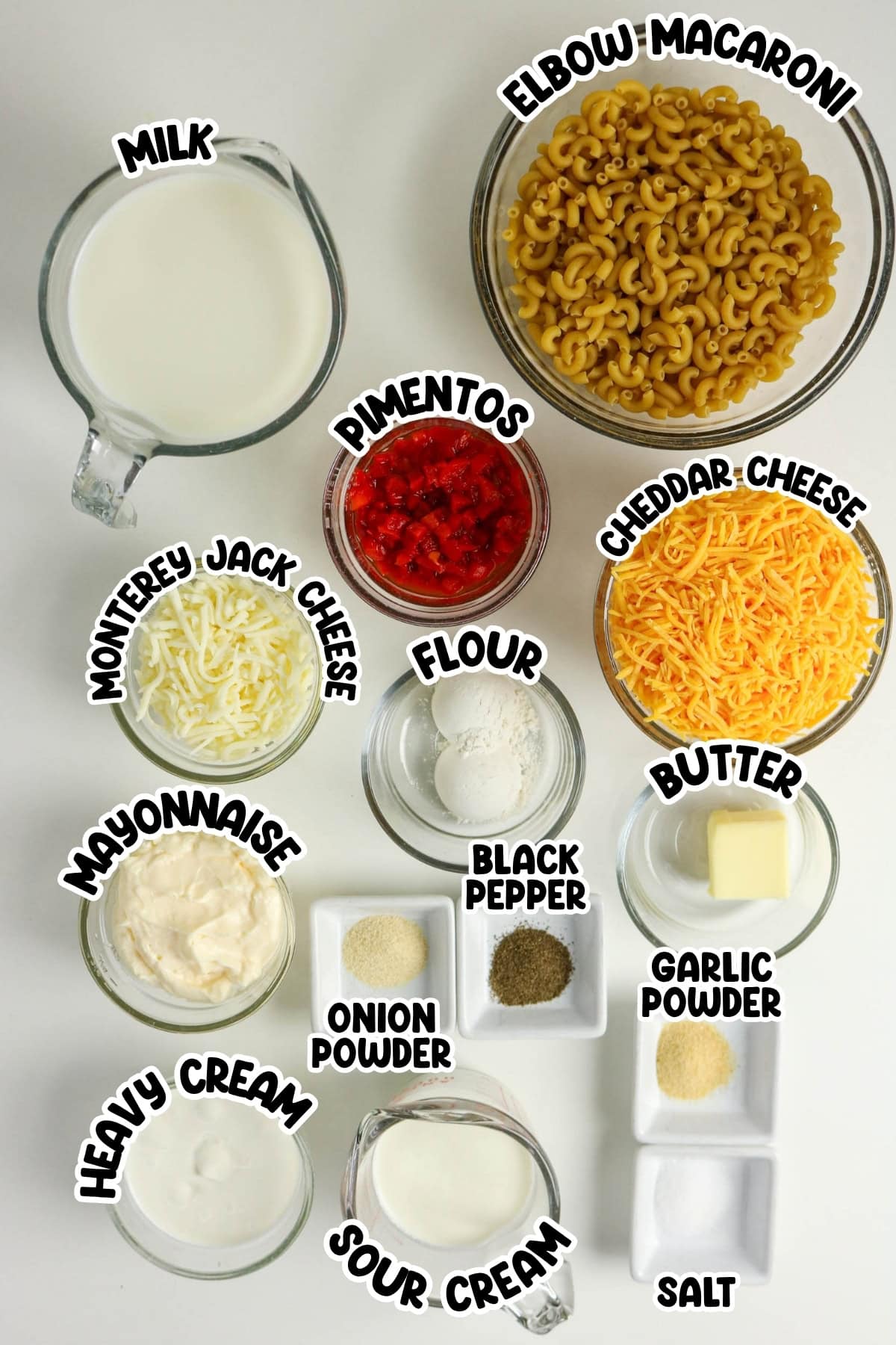 Ingredients for macaroni and cheese in bowls, labeled with names.