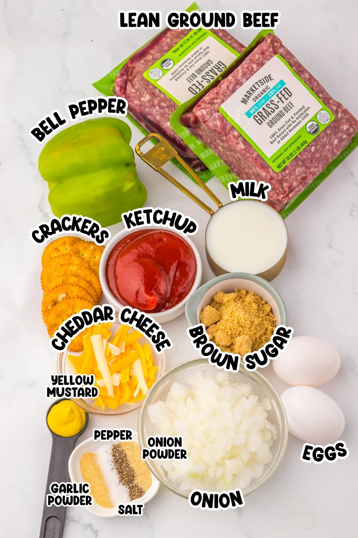 Ingredients for meatloaf, including beef, eggs, cheese, peppers, and seasonings.