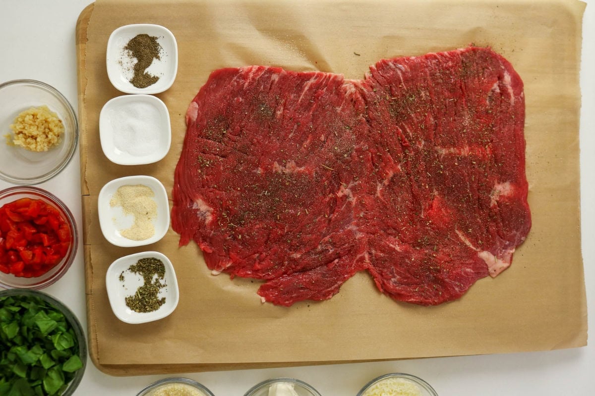 Beef slices seasoned with salt, pepper, granulated garlic, and dried herbs.