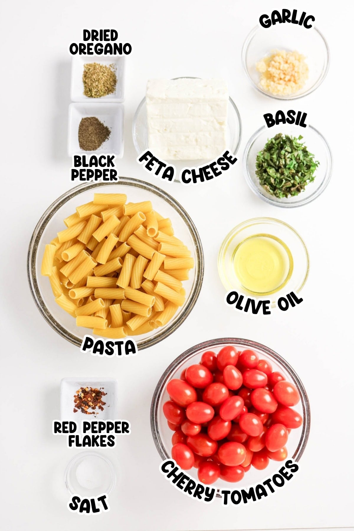 Pasta, cherry tomatoes, feta, olive oil, garlic, basil, oregano, pepper, salt, flakes.