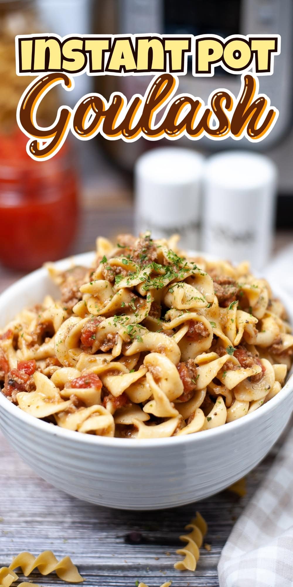 Bowl of goulash with noodles and meat.