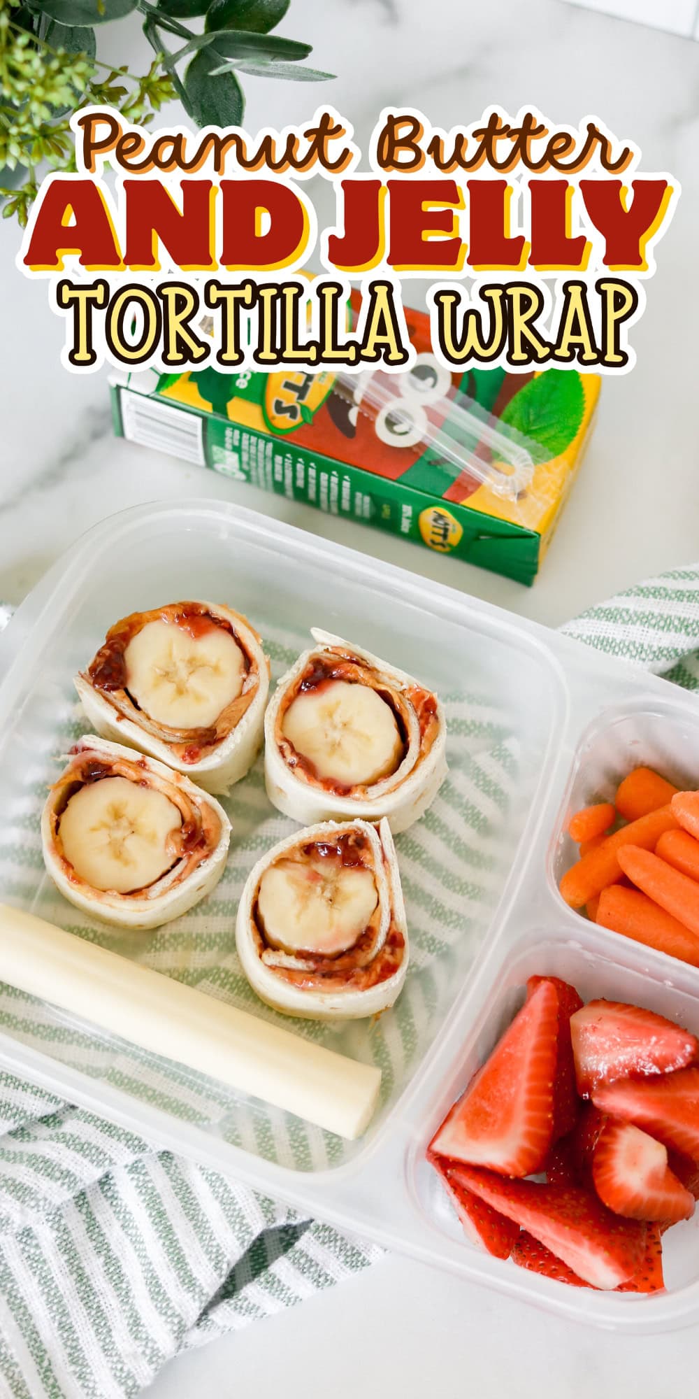 A lunchbox with peanut butter banana wraps, strawberries, and carrots.