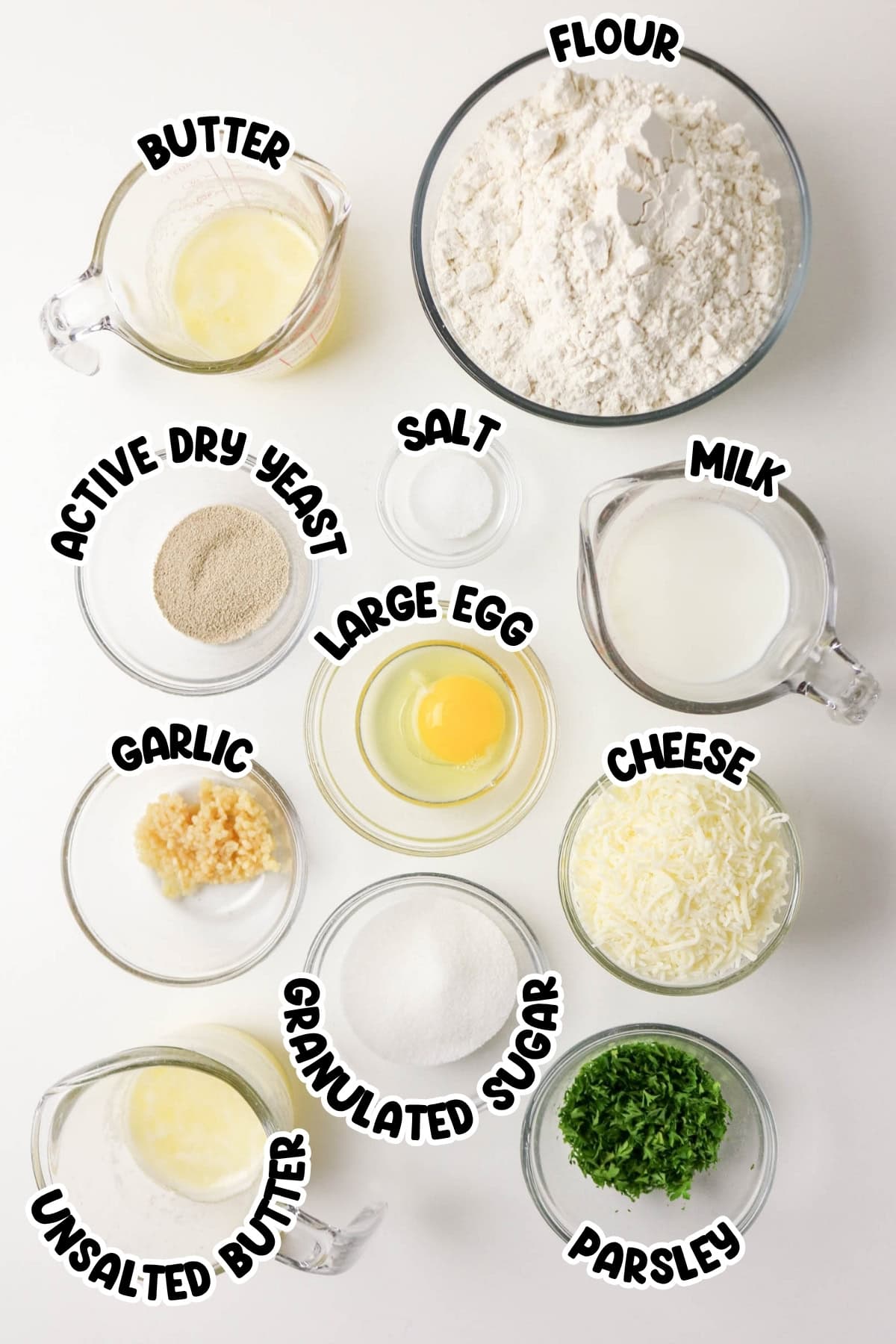 Butter, flour, yeast, salt, milk, egg, garlic, cheese, sugar, parsley.