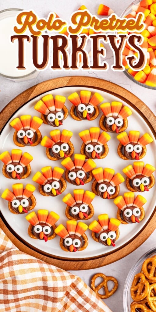 Plate of Rolo pretzel turkeys decorated with candy corn and candy eyes.