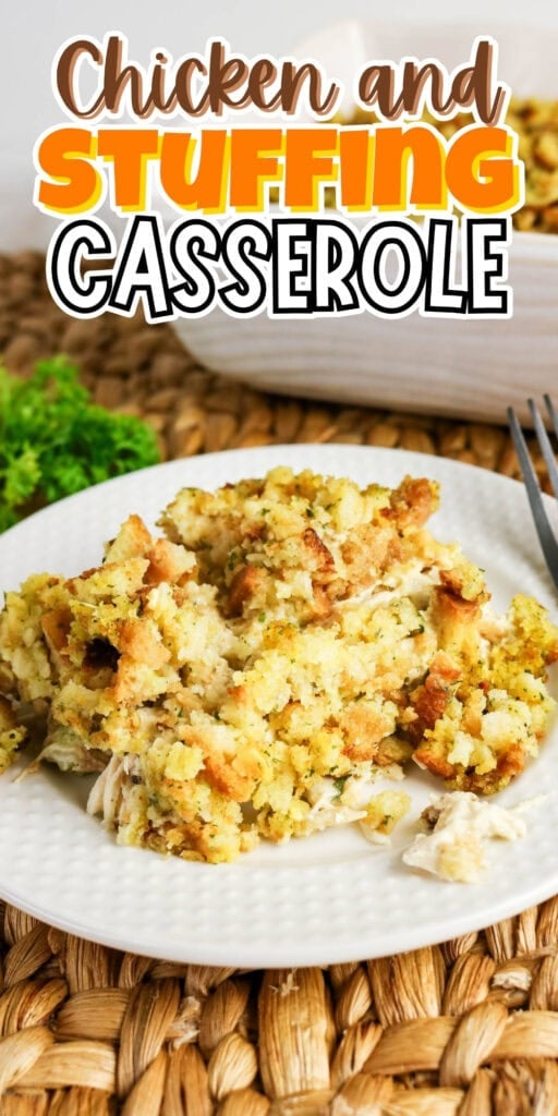 Chicken and stuffing casserole served on a white plate with a fork nearby.