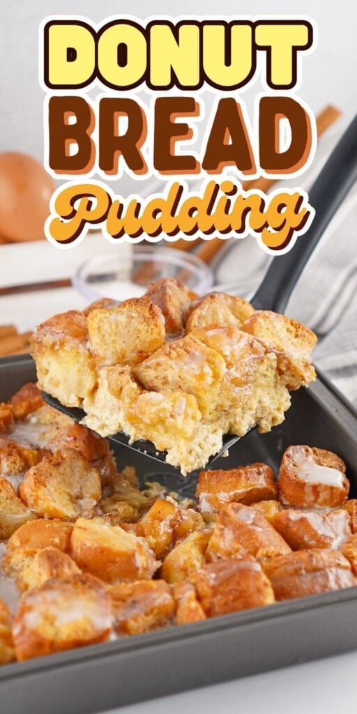 A spatula lifts donut bread pudding from a baking pan.
