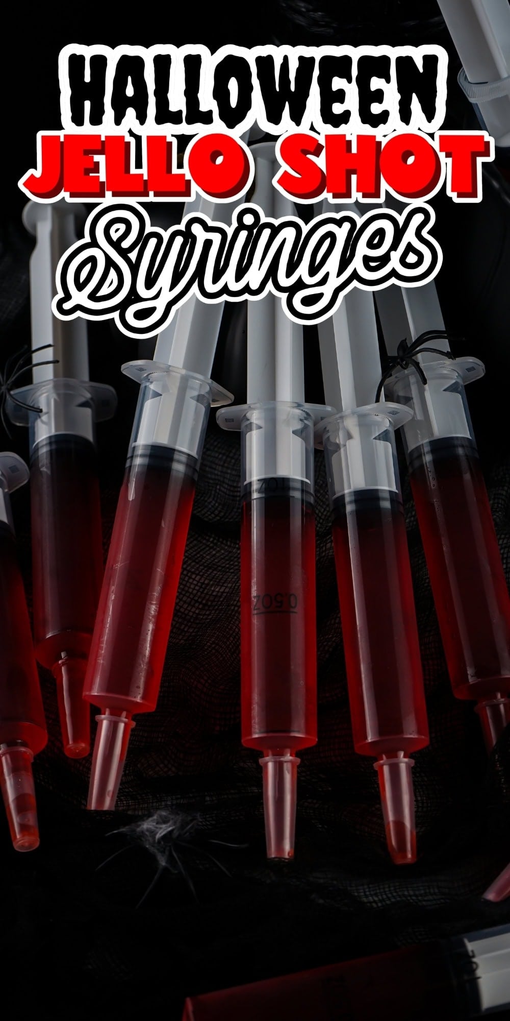 Several syringes filled with red jello.