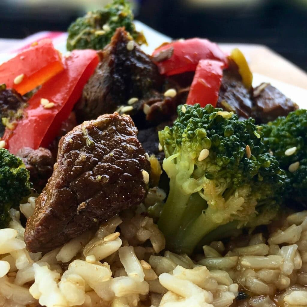 Brown rice, beef, broccoli, red peppers, and sesame seeds form this stir-fry.