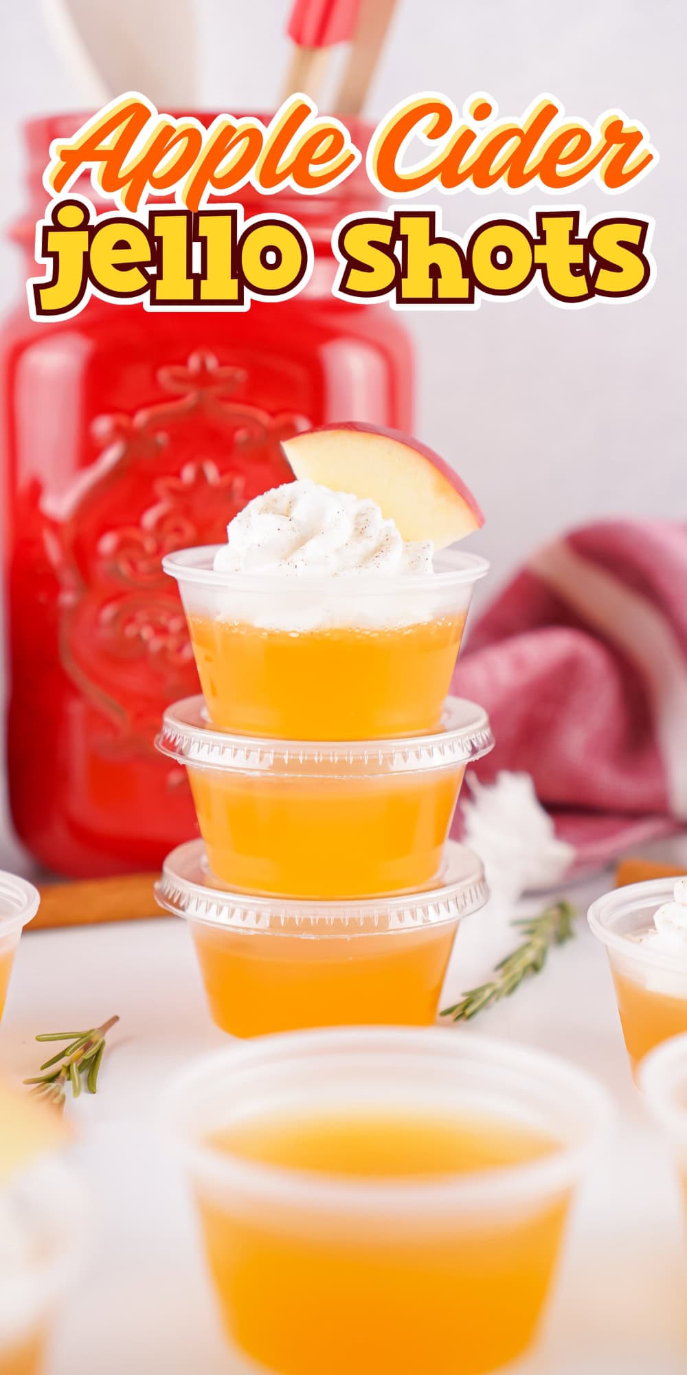 Apple Cider jello shots with apple cider, gelatin, and whipped cream topping.