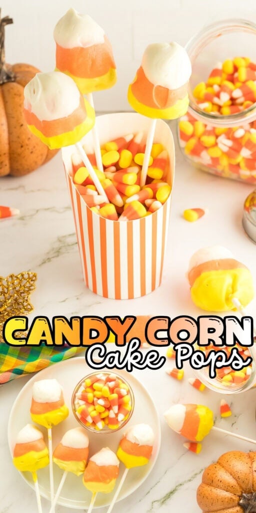 Candy corn cake pops in a striped cup, surrounded by candy corn and pumpkins.