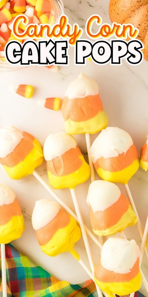 Candy corn cake pops on sticks, decorated in white, orange, and yellow.