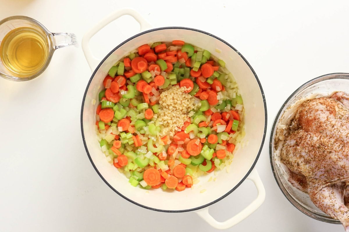 Sauté veggies, add seasoned chicken and broth.