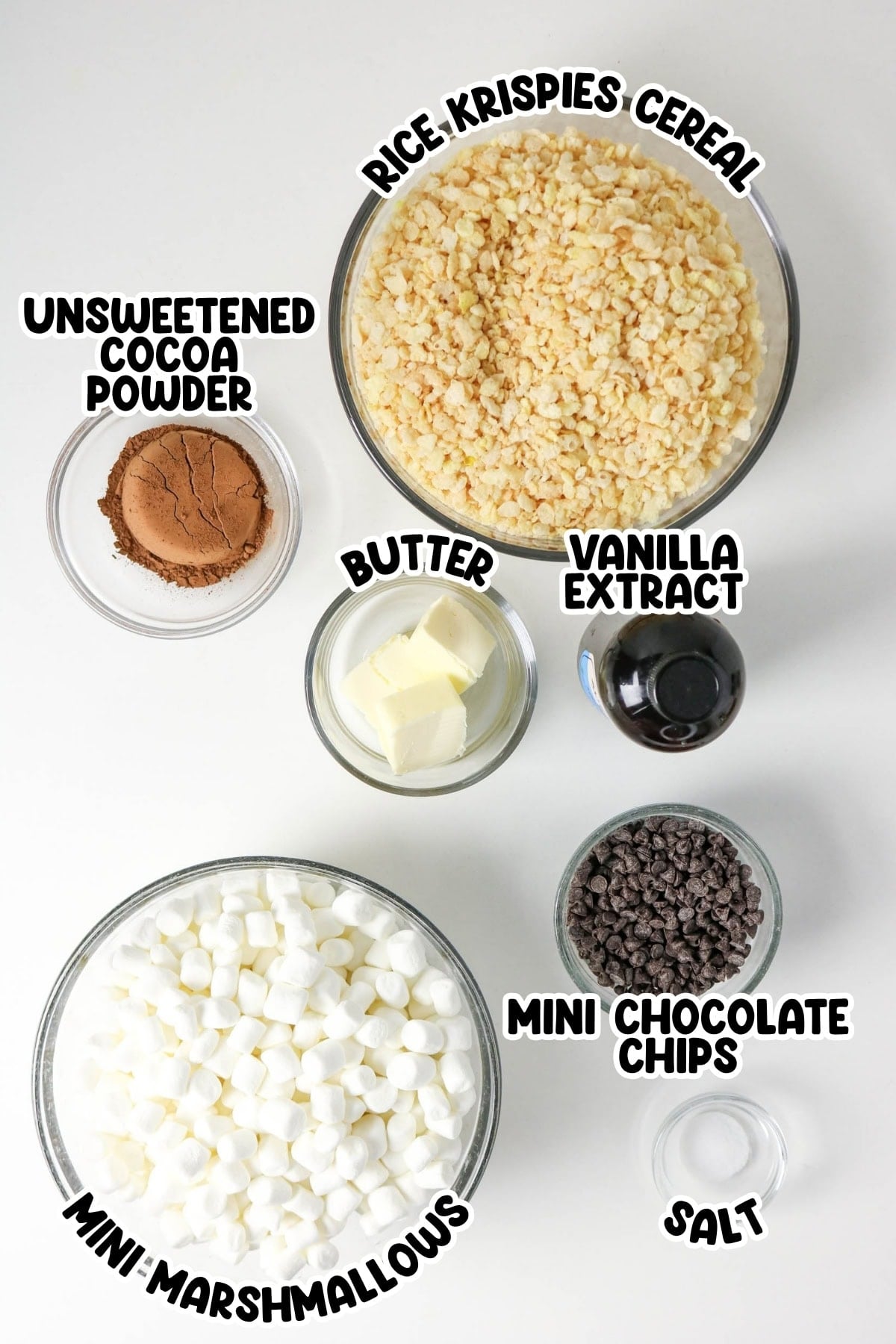 Bowls of marshmallows, Rice Krispies, cocoa, butter, vanilla, chips, and salt.